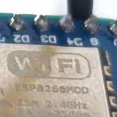 Crop of the ESP8266 module's etched text encoded at SSIMULACRA2 65